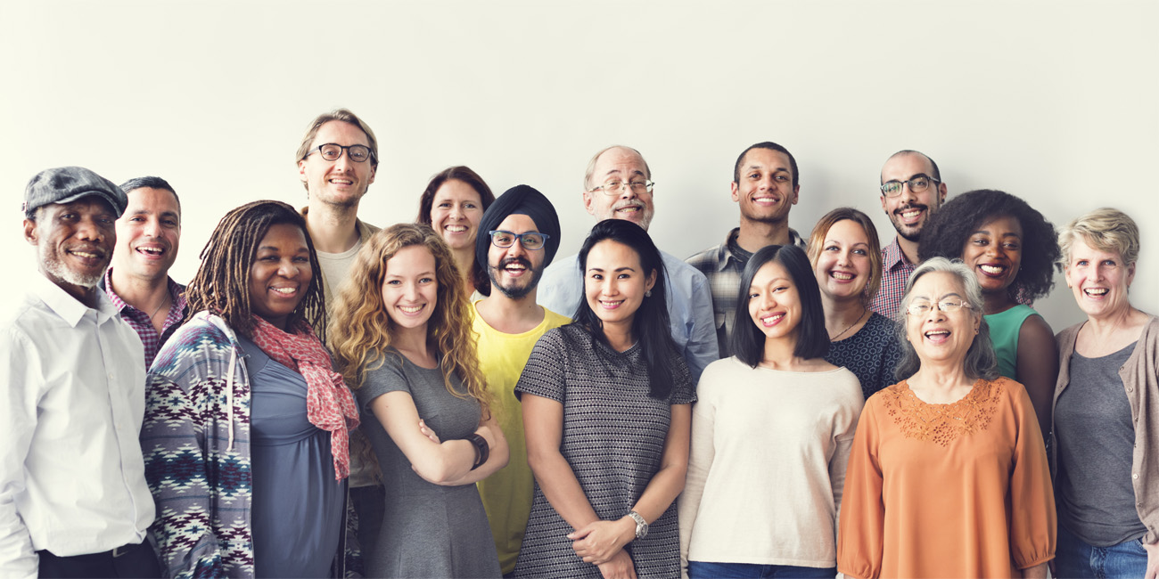 Diverse group of co-workers posing for a picture together